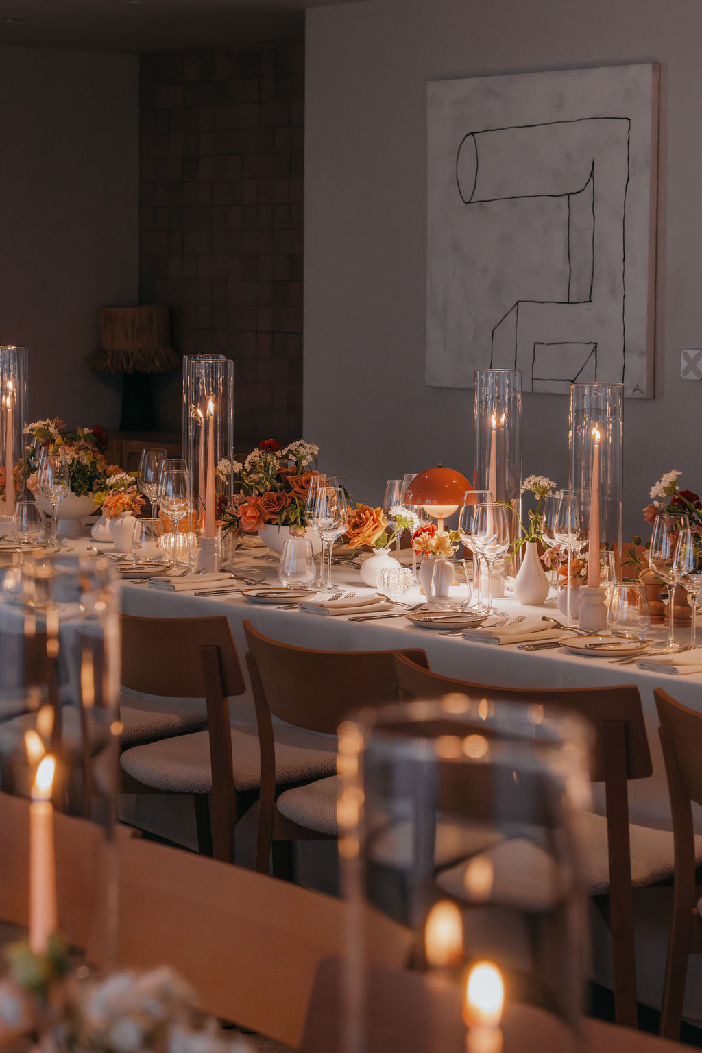 A beautifully arranged table featuring candles and flowers, creating an elegant and inviting atmosphere.