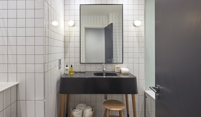 A stylish bathroom featuring a classic black and white tile floor, creating a timeless and elegant atmosphere.